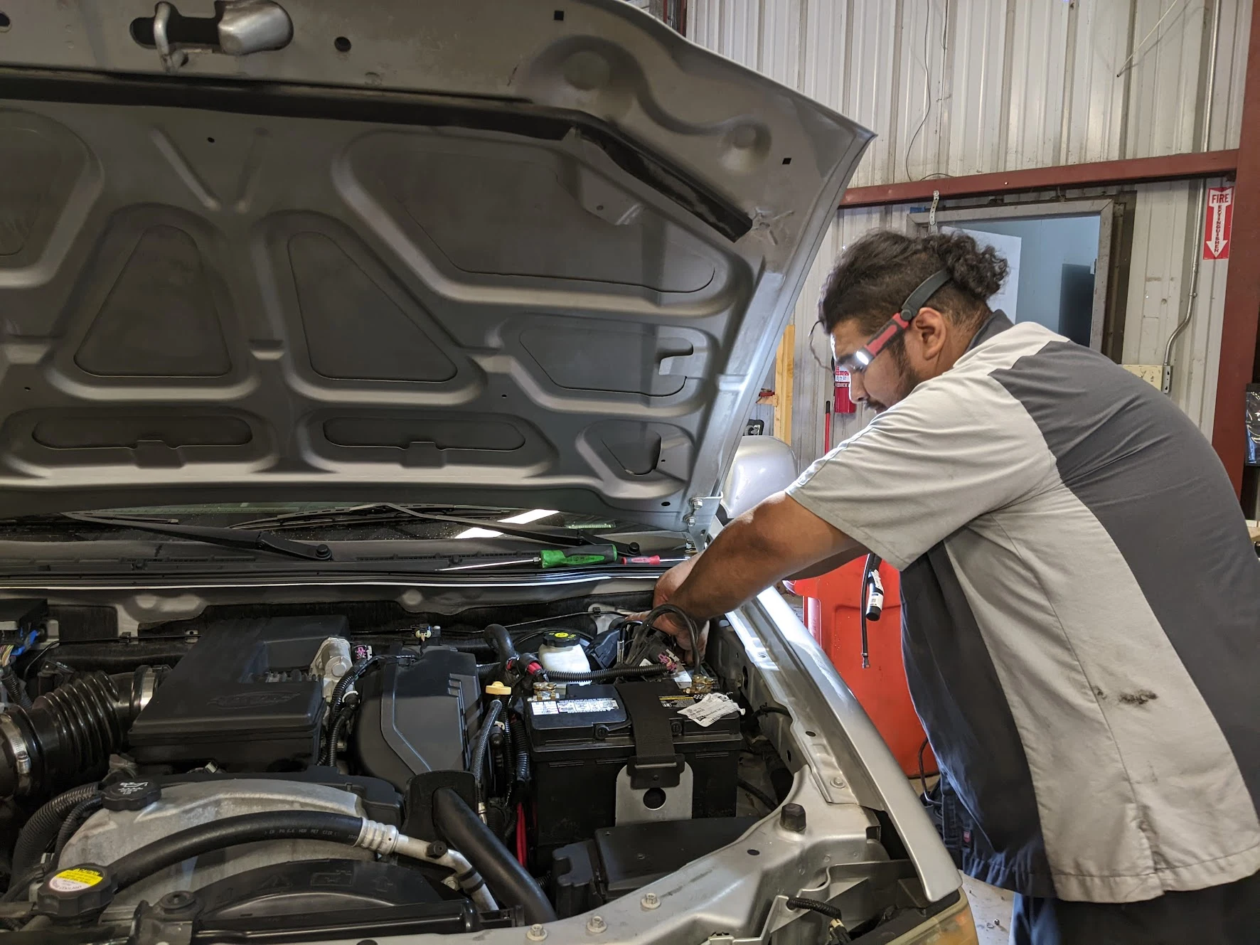 HDM mechanic working under the hood in the Bakersfield shop